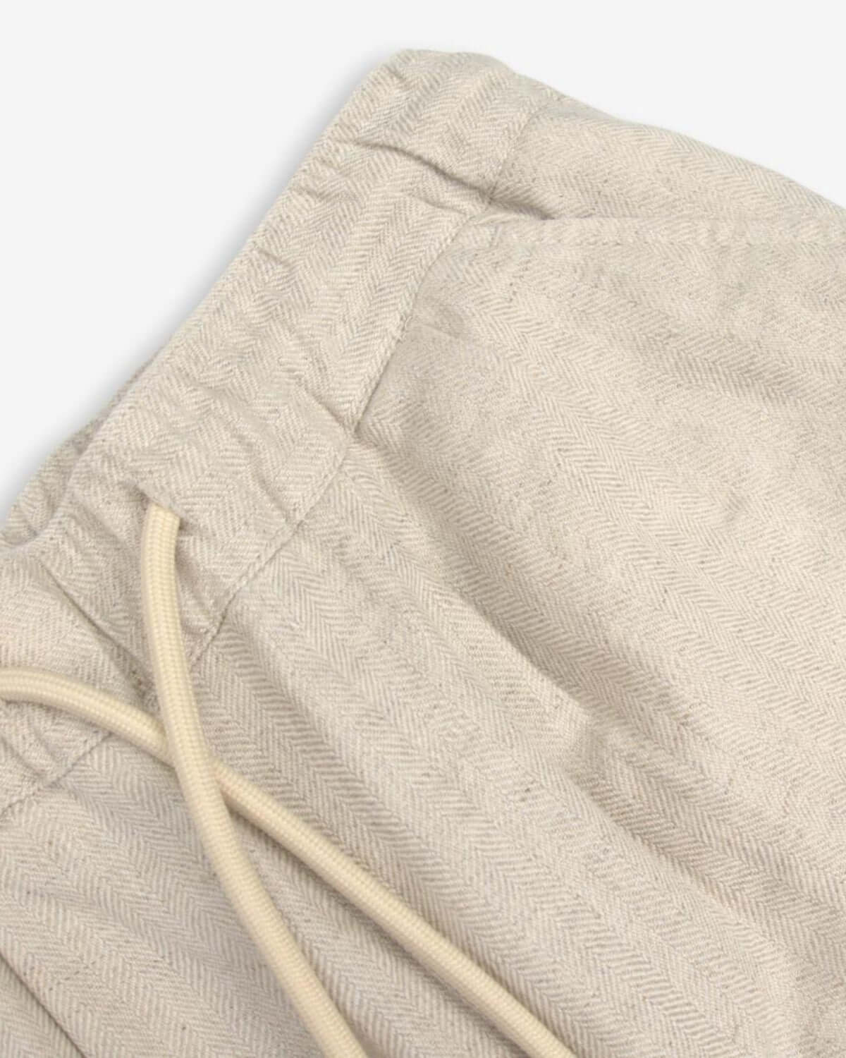 Close-up of the stylish Sand Linen Resort Pant, showcasing its comfy fit and adjustable drawstring for adventure-loving kids!