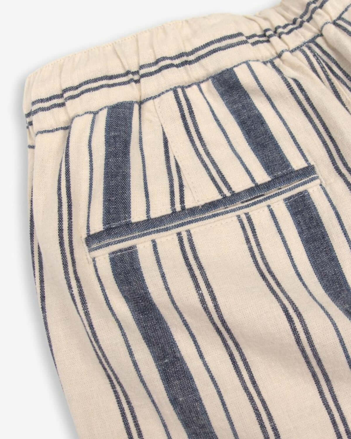Detail of the Seaside Stripe Linen Resort Pant showcasing stylish coastal stripes and a comfy elastic waistband.