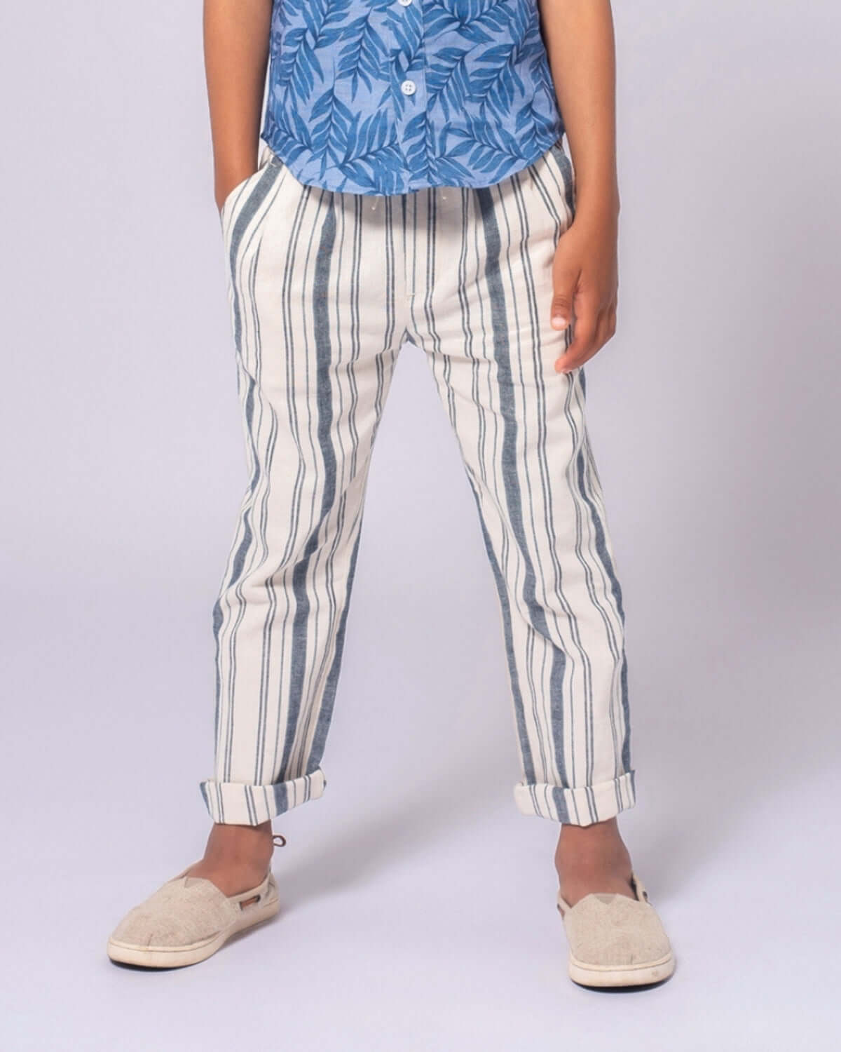 Stylish boy rocking Seaside Stripe Linen Resort Pant, ready for sunny adventures in comfy kids clothes.