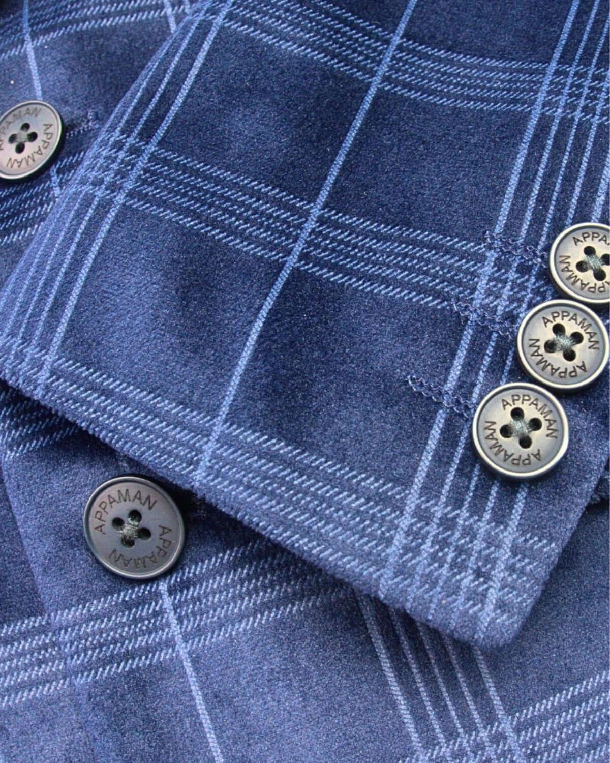 Detail of our stylish Blue Velvet Suit Blazer for kids, showcasing its luxe fabric and smart Appaman buttons.