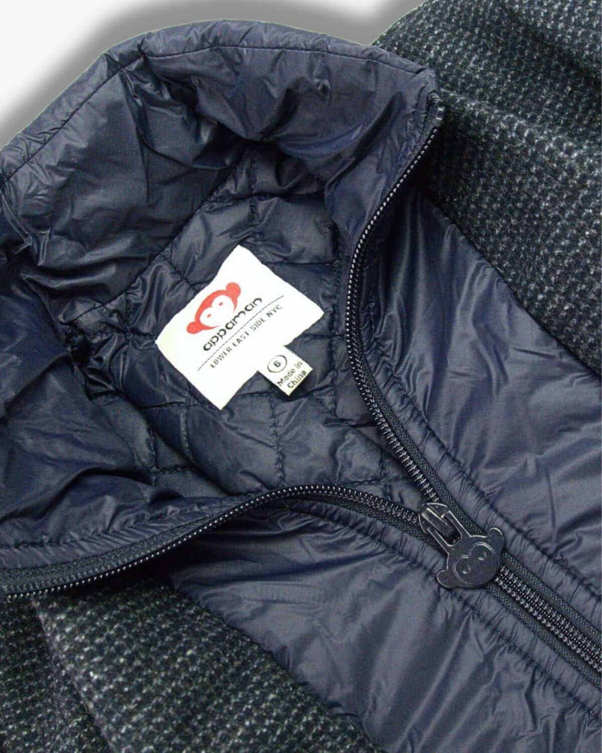 Cozy interior of Appaman's Checkered Ink City Overcoat—stylish warmth for kids' chilly outings, with pockets for adventure!