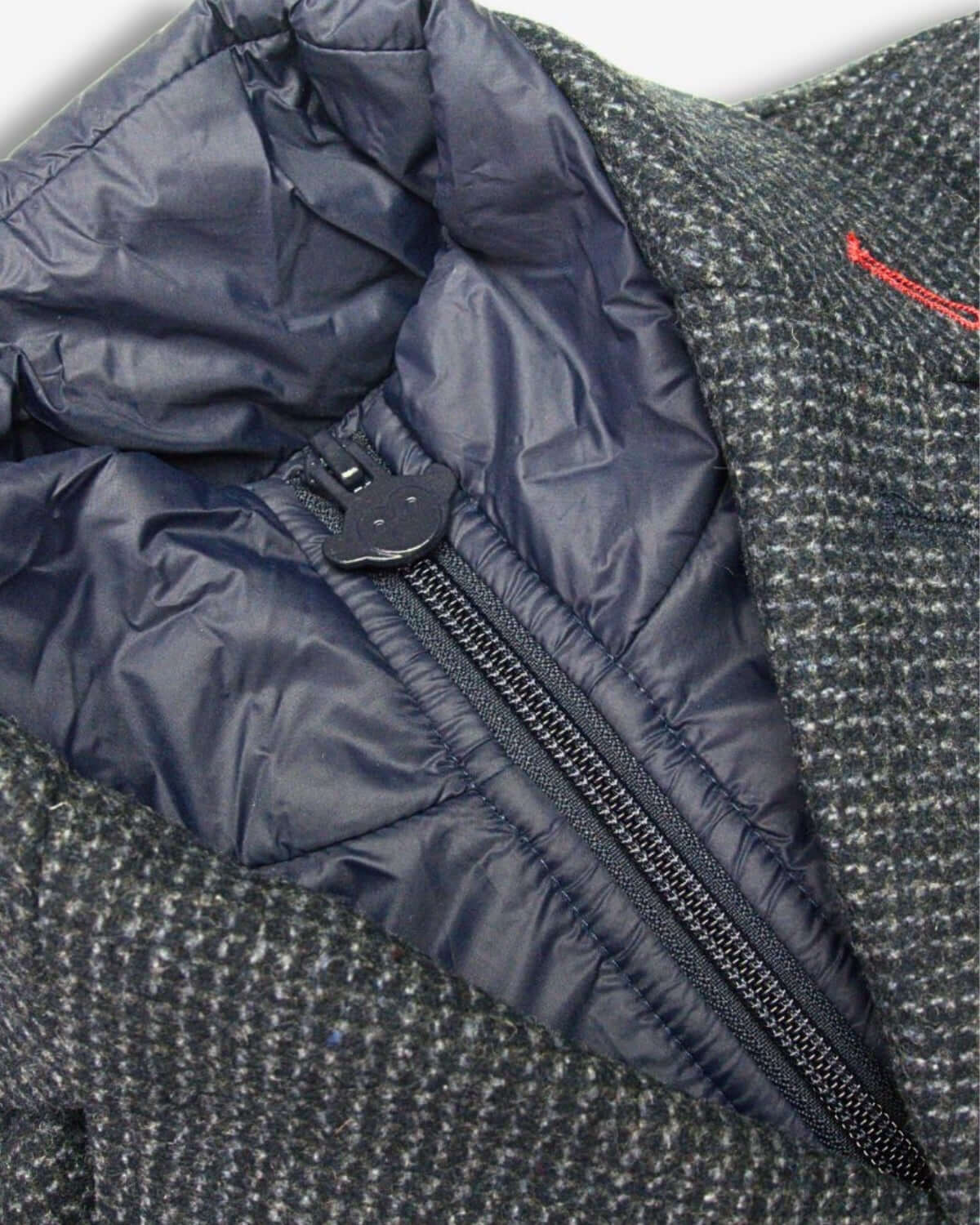 Stylish Checkered Ink Overcoat interior with cozy lining and zip for a snug fit, ideal for dapper kids ready for chilly adventures.