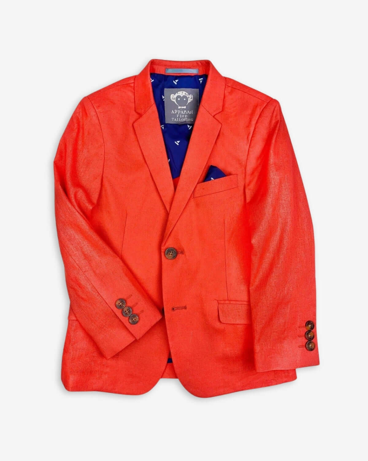 Bright coral sports jacket with notch lapels and a stylish pocket square—playful kids clothes for back to school fashion!