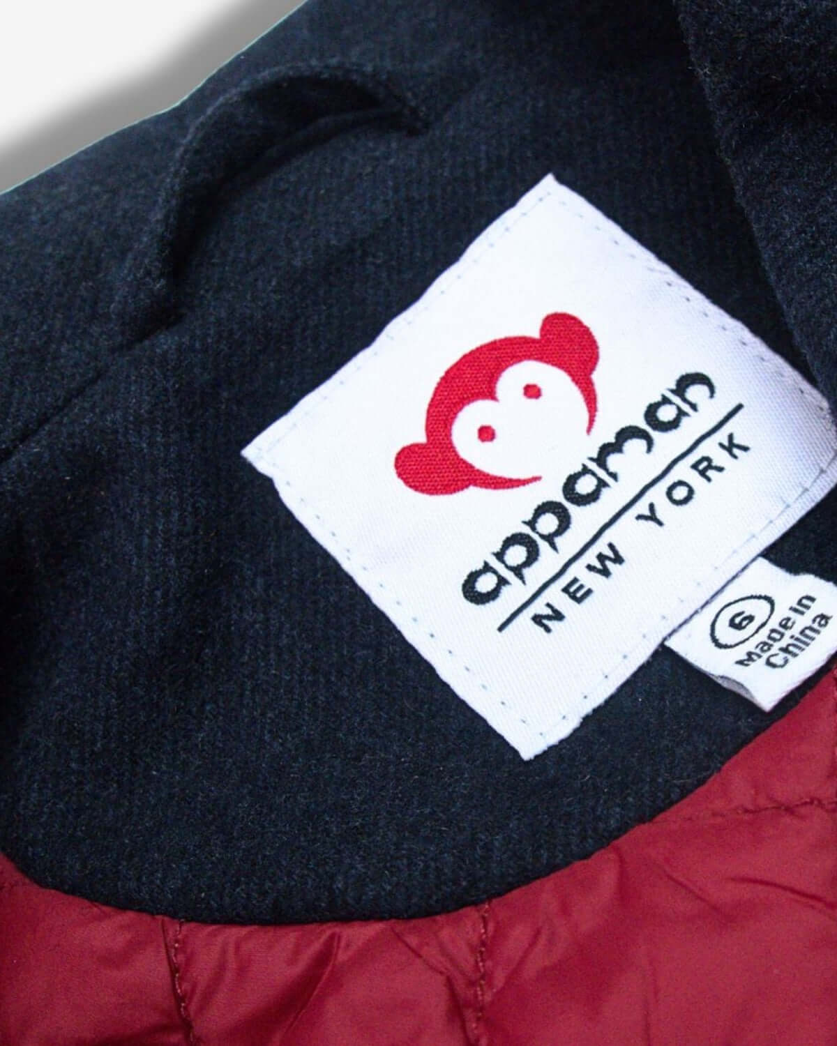 Appaman's signature logo on a cozy Midnight Navy Pelham Peacoat, where style meets durability for cool kids' fashion!