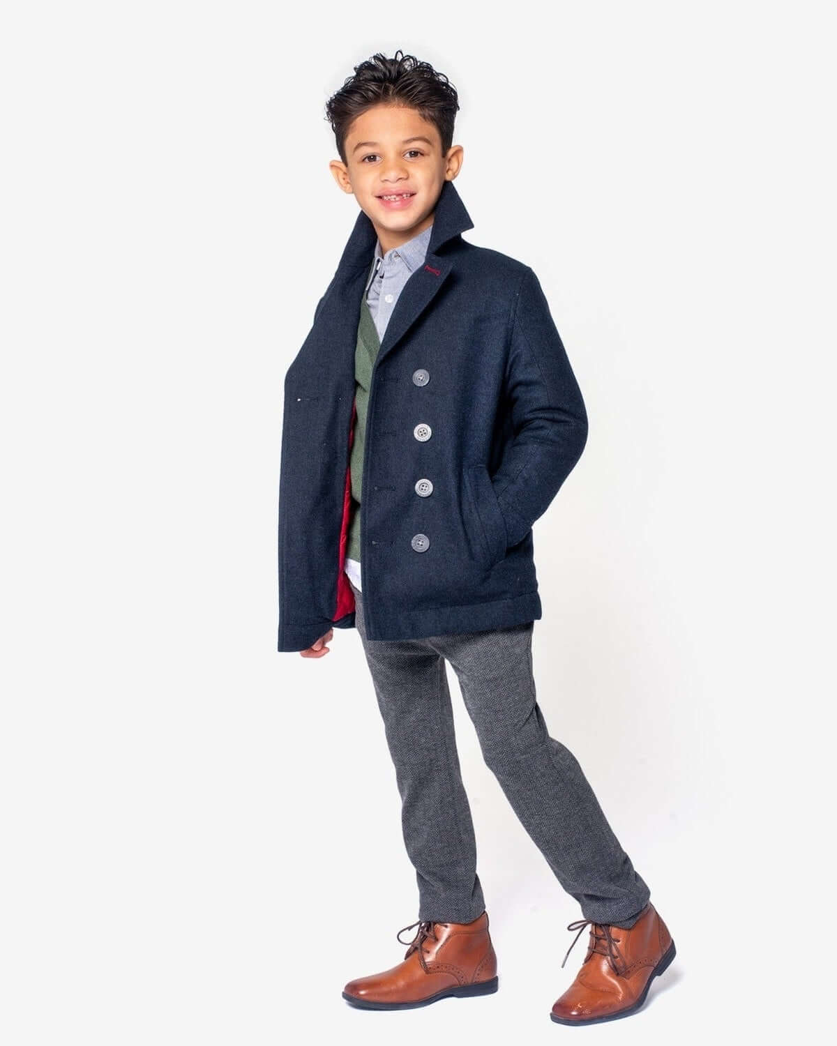Stylish boy in a midnight navy Pelham peacoat, bringing chic warmth to back-to-school looks. High-quality kids clothes for standout style!