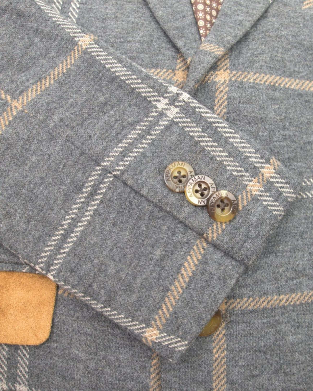 Close-up of Appaman's Smoky Windowpane Club Jacket showcasing stylish plaid design and elegant button detailing.