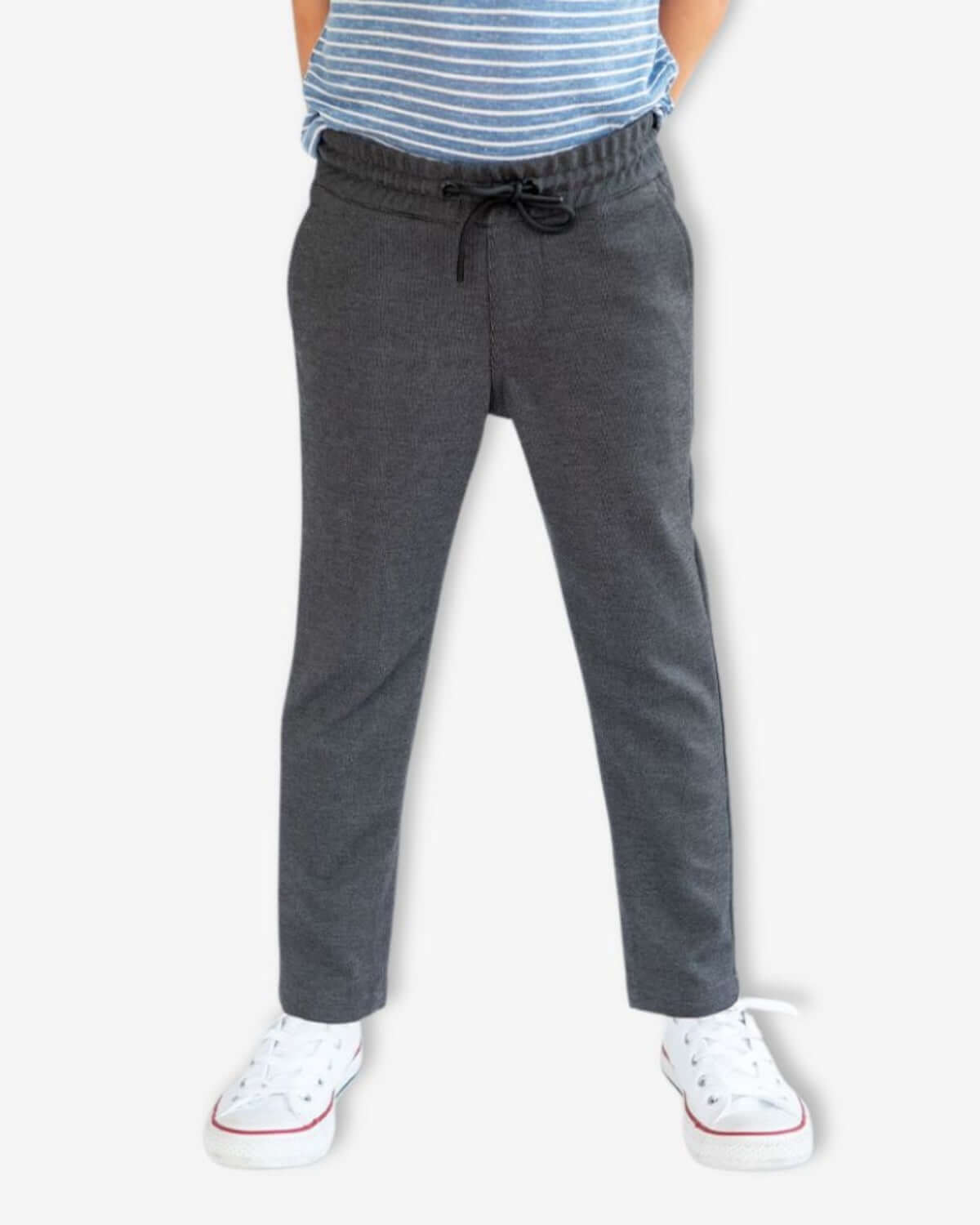 Dark Grey Everyday Stretch Pants worn by a child, featuring a drawstring and straight-leg design.