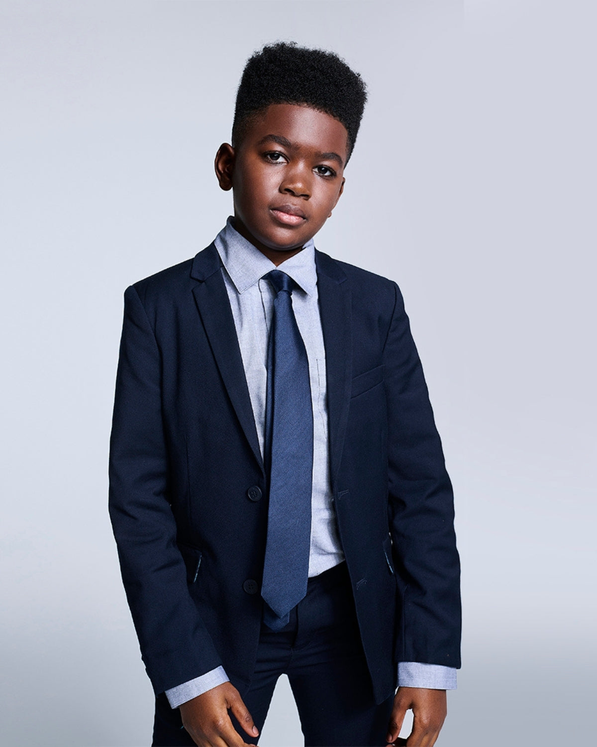 Navy Blue Mod Suit worn by a young boy, showcasing a stylish tailored fit and refined details for formal occasions.
