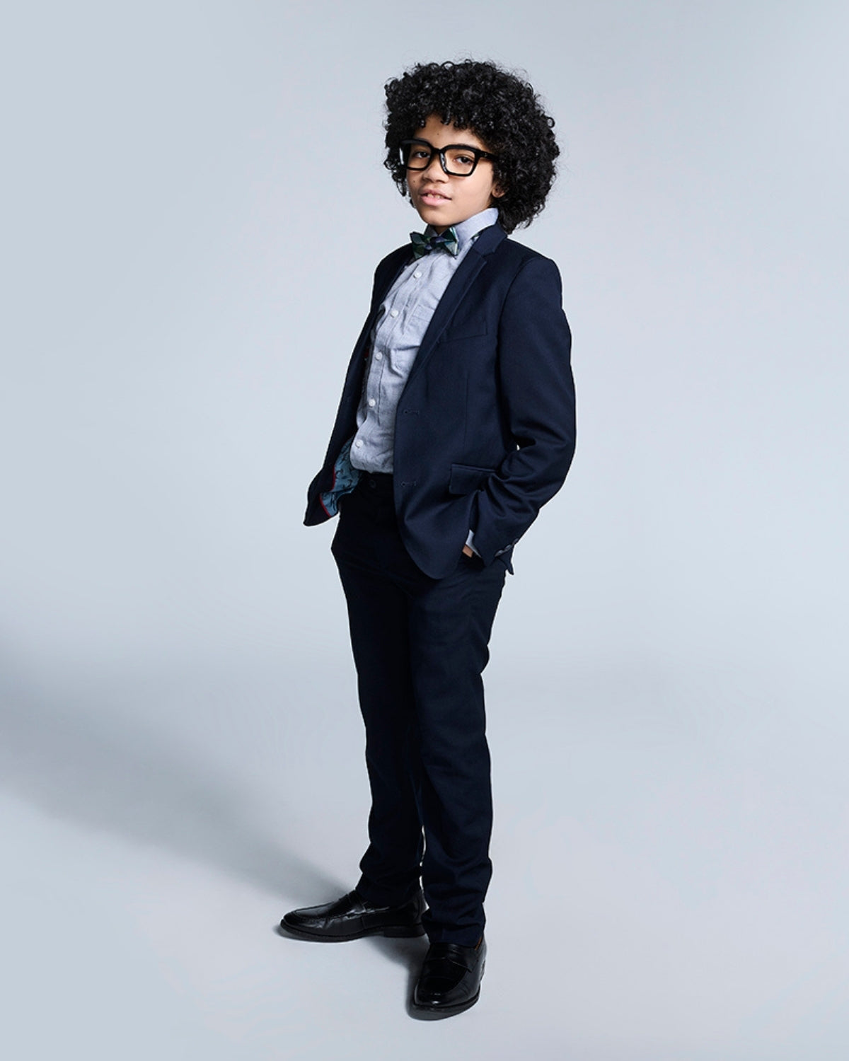Stylish boy in a navy blue Mod Suit, perfect for school events and special occasions. Tailored for comfort and confidence!