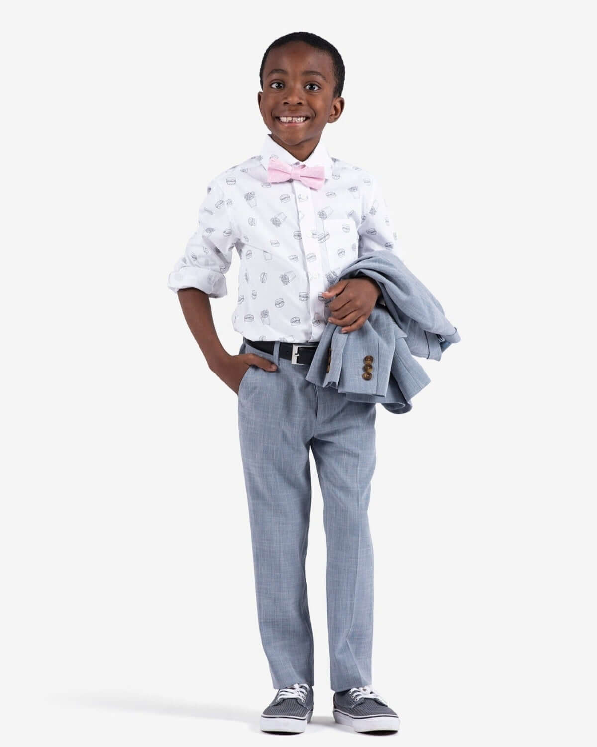 Stylish boy in a fun burger & fries shirt, bow tie, and smart pants—perfect for kids' back-to-school adventures!