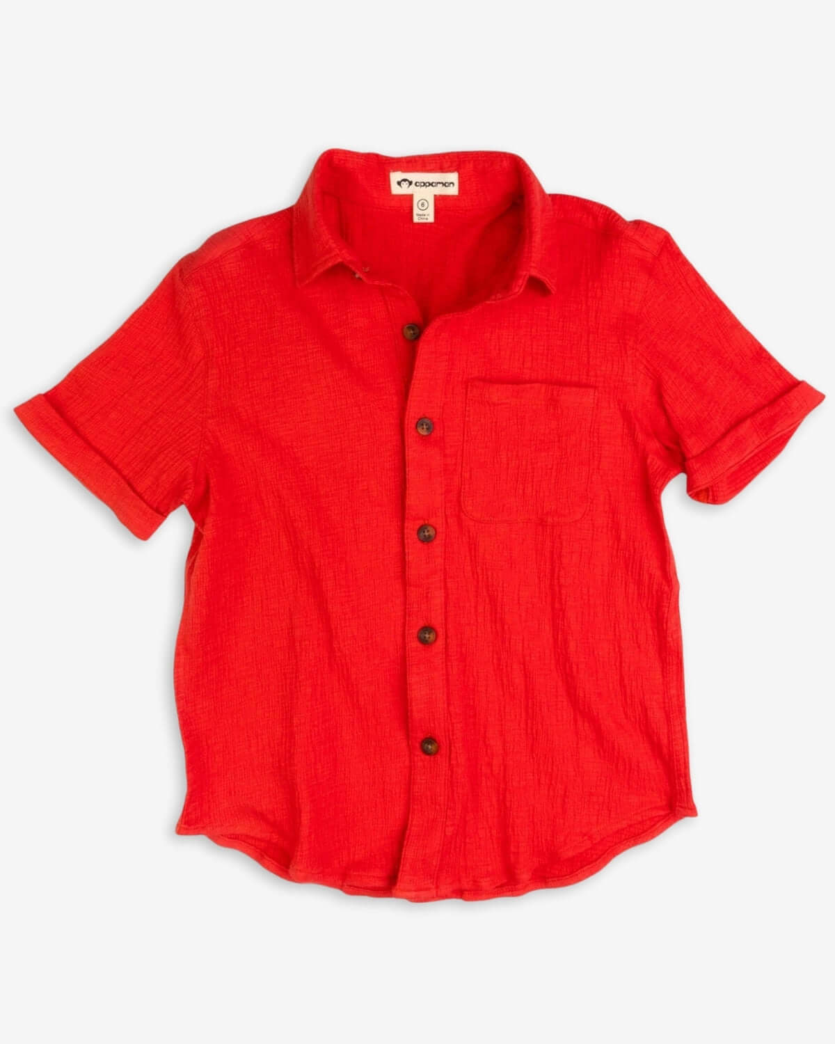 Vibrant coral beach shirt for kids—stylish and comfy with a patch pocket, perfect for summer adventures!