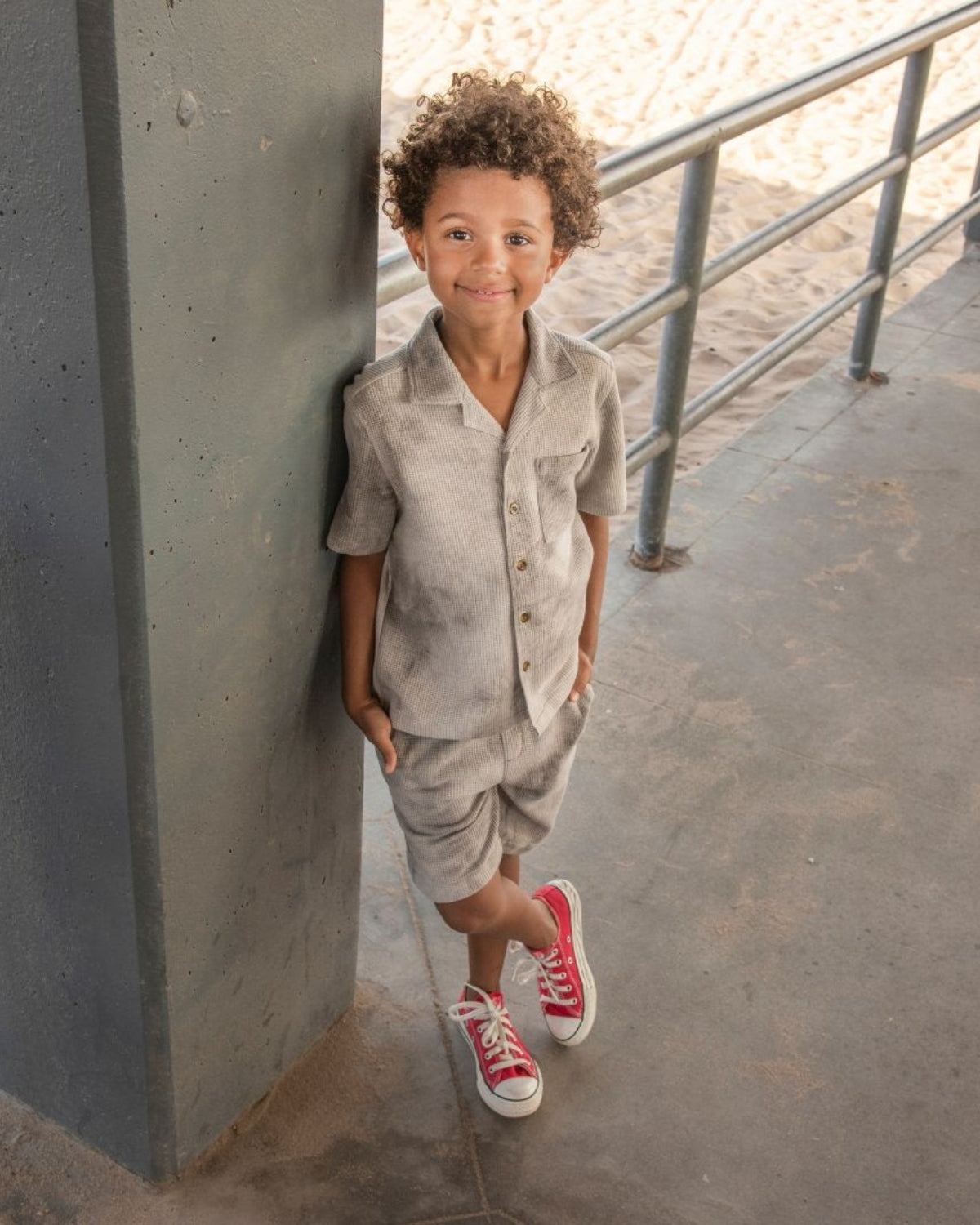 Stylish boy in a grey tie dye resort shirt and shorts, perfect for summer adventures—high quality, playful kids clothes.
