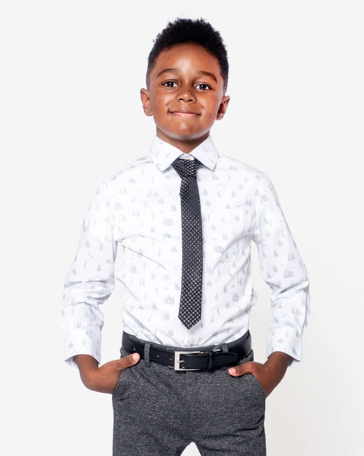 Stylish boy in a playful dress shirt and tie, ready for back-to-school adventures—high-quality kids clothes for confident kids!