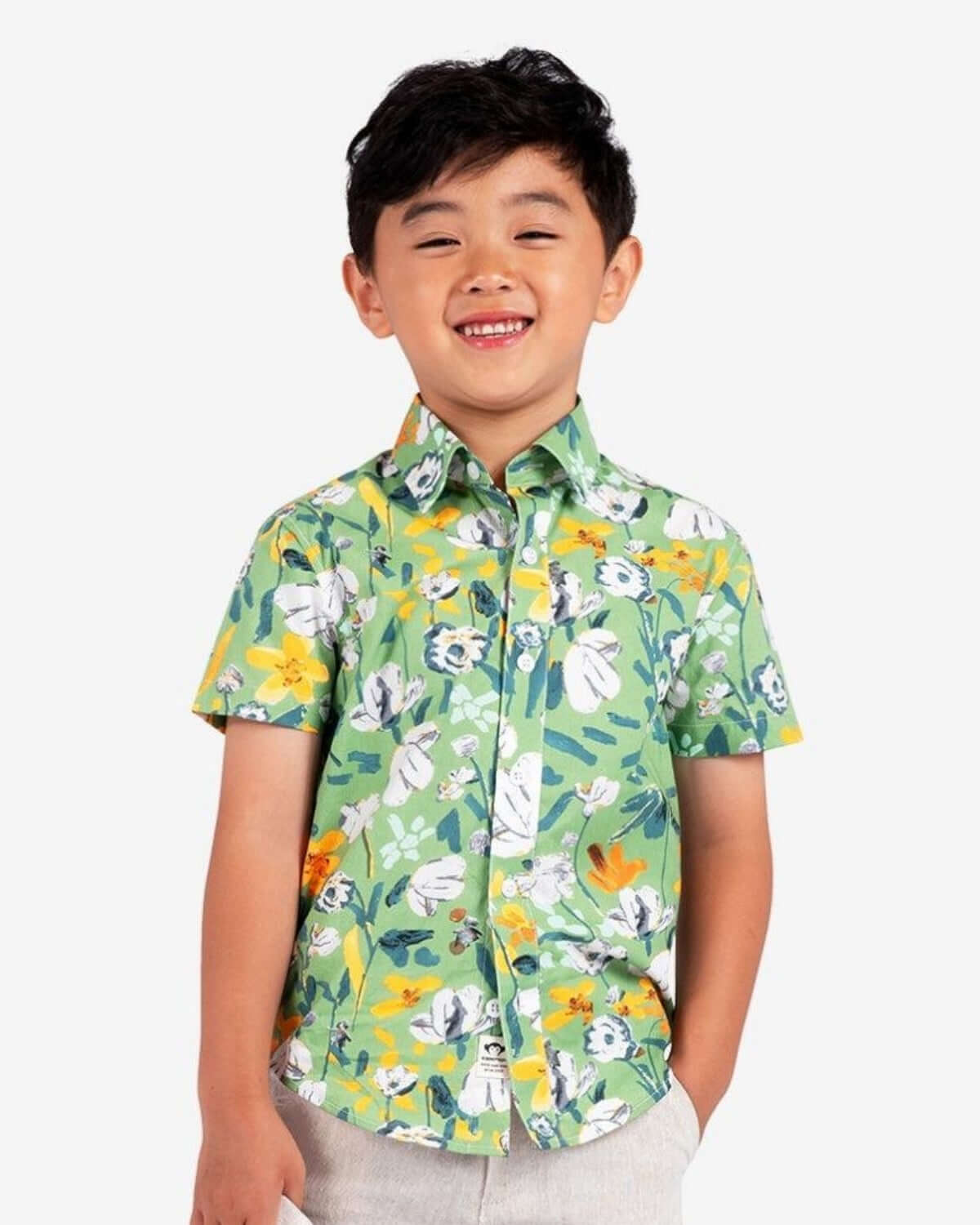 Stylish boy sporting a vibrant Ivy Rose Day Party shirt, perfect for fun, festive moments in high-quality kids clothes.