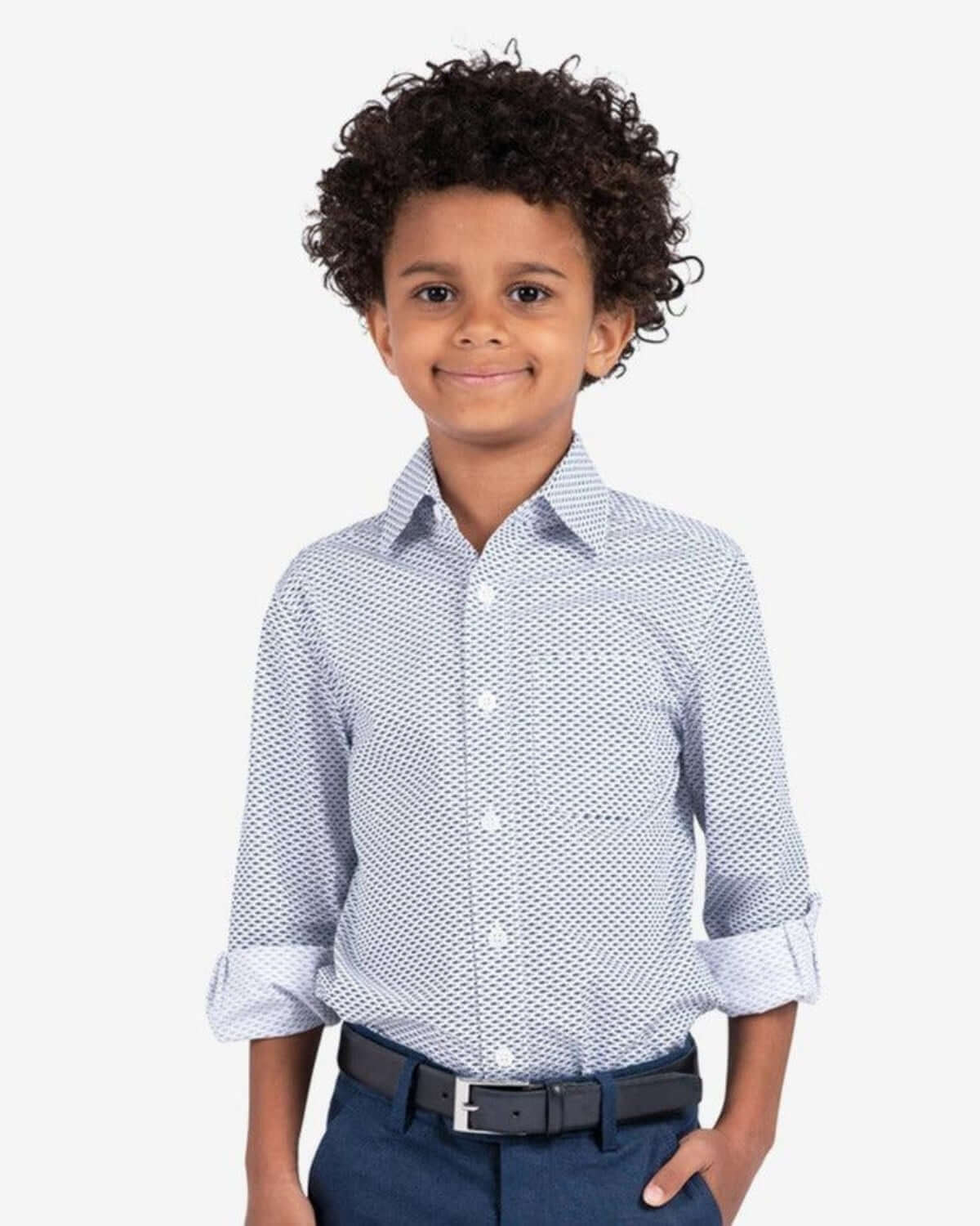Stylish kid in a fun navy shark print shirt—durable kids clothes for back to school adventures!