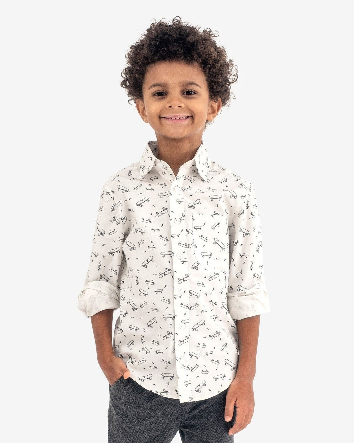 Cool kid in a fun skater vibes shirt, showcasing high-quality style for back to school adventures!