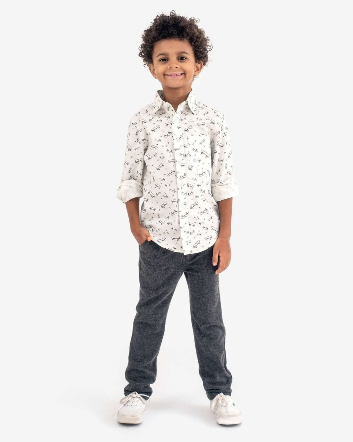 Child wearing Skater Vibes Standard Button Down shirt with stylish pants, showcasing a fun, trendy look.