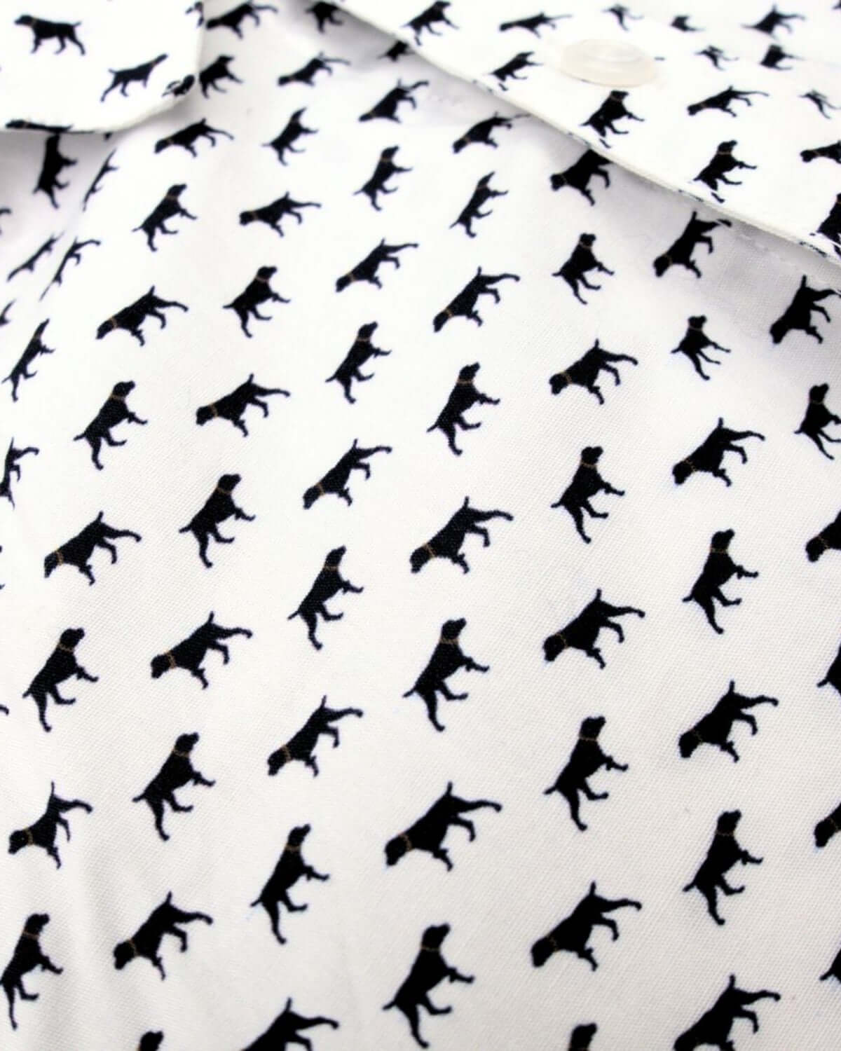 Playful black dog print on a stylish white shirt, perfect for kids' confident back-to-school looks!