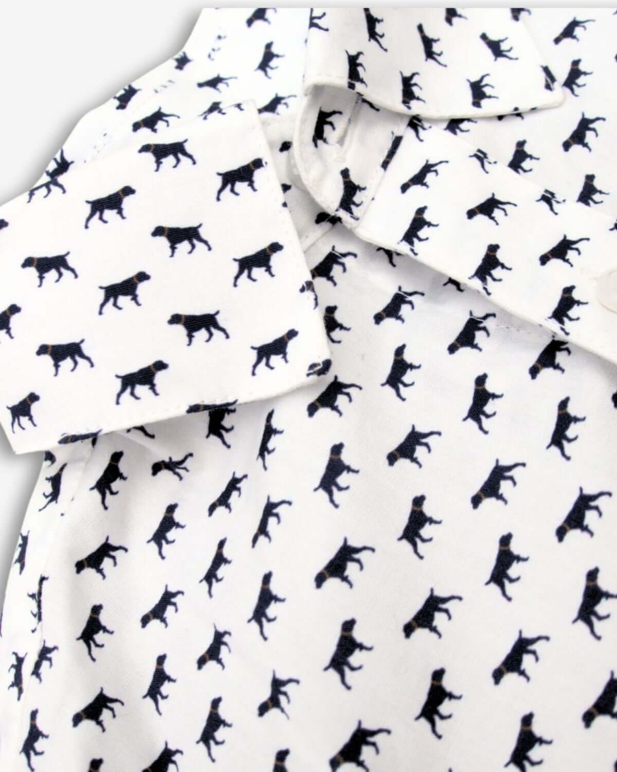 Playful dog print adorns this stylish cotton shirt, perfect for kids' high-quality back-to-school wardrobes.