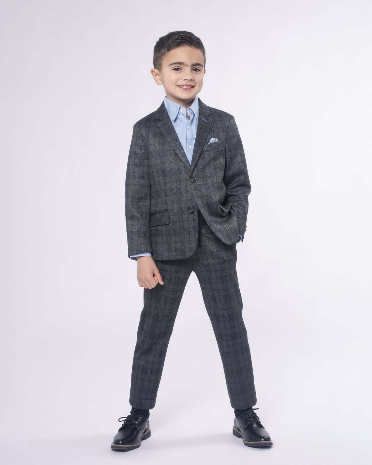 Stylish boy in a grey plaid stretchy mod suit, perfect for back to school and special occasions, showcasing playful elegance.