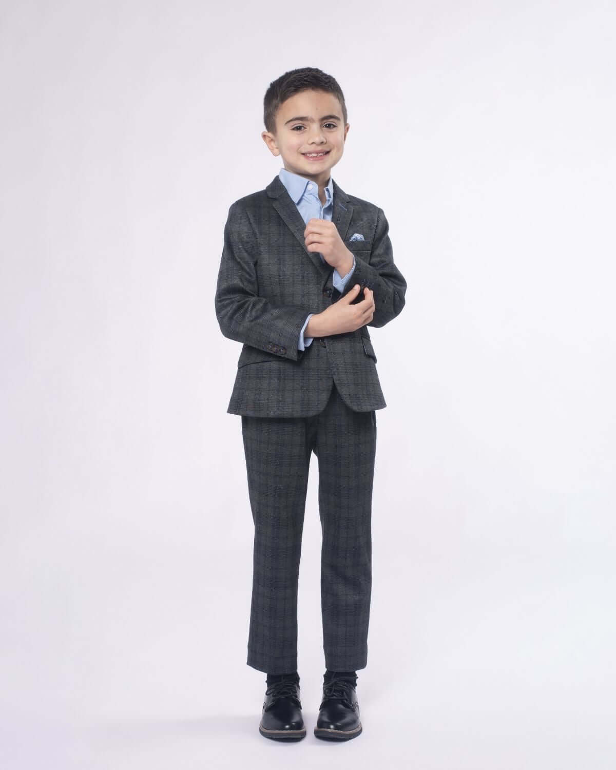 Stylish boy in a grey plaid stretchy mod suit, ready for back to school in high-quality kids clothes.