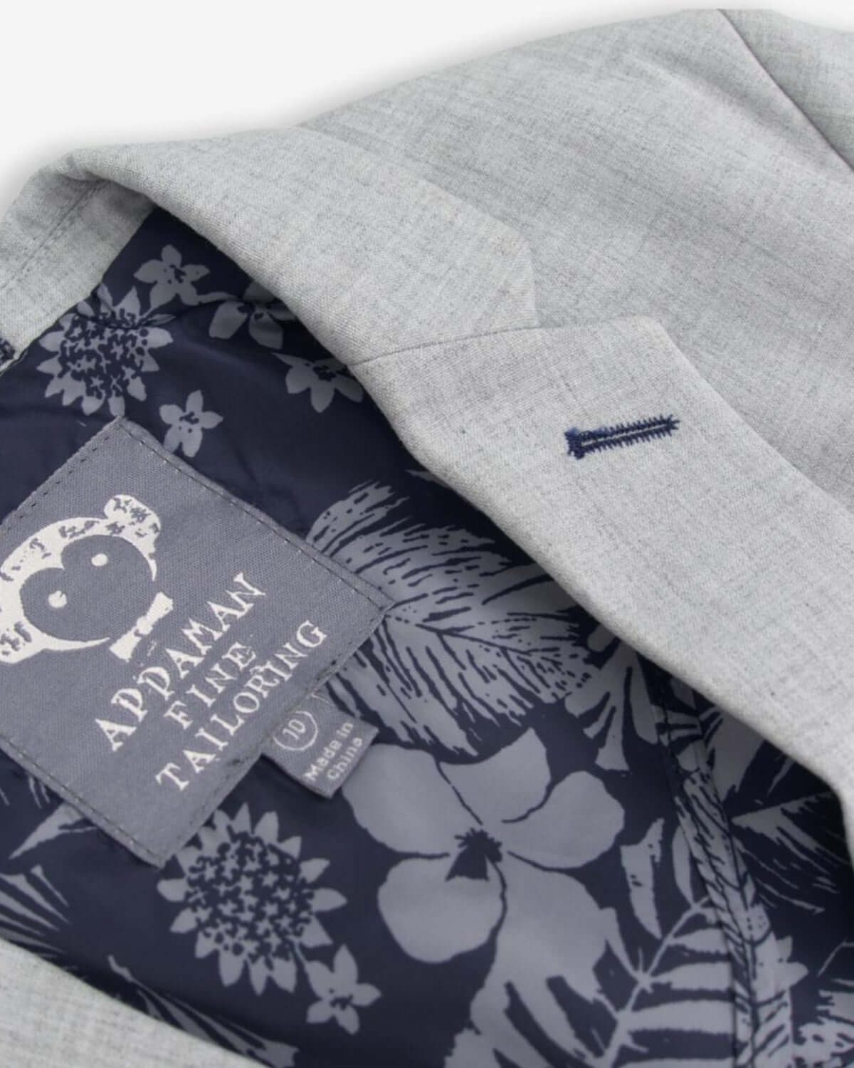 Stylish high rise grey mod suit interior showing playful pattern and Appaman’s signature label for trendy kids clothes.