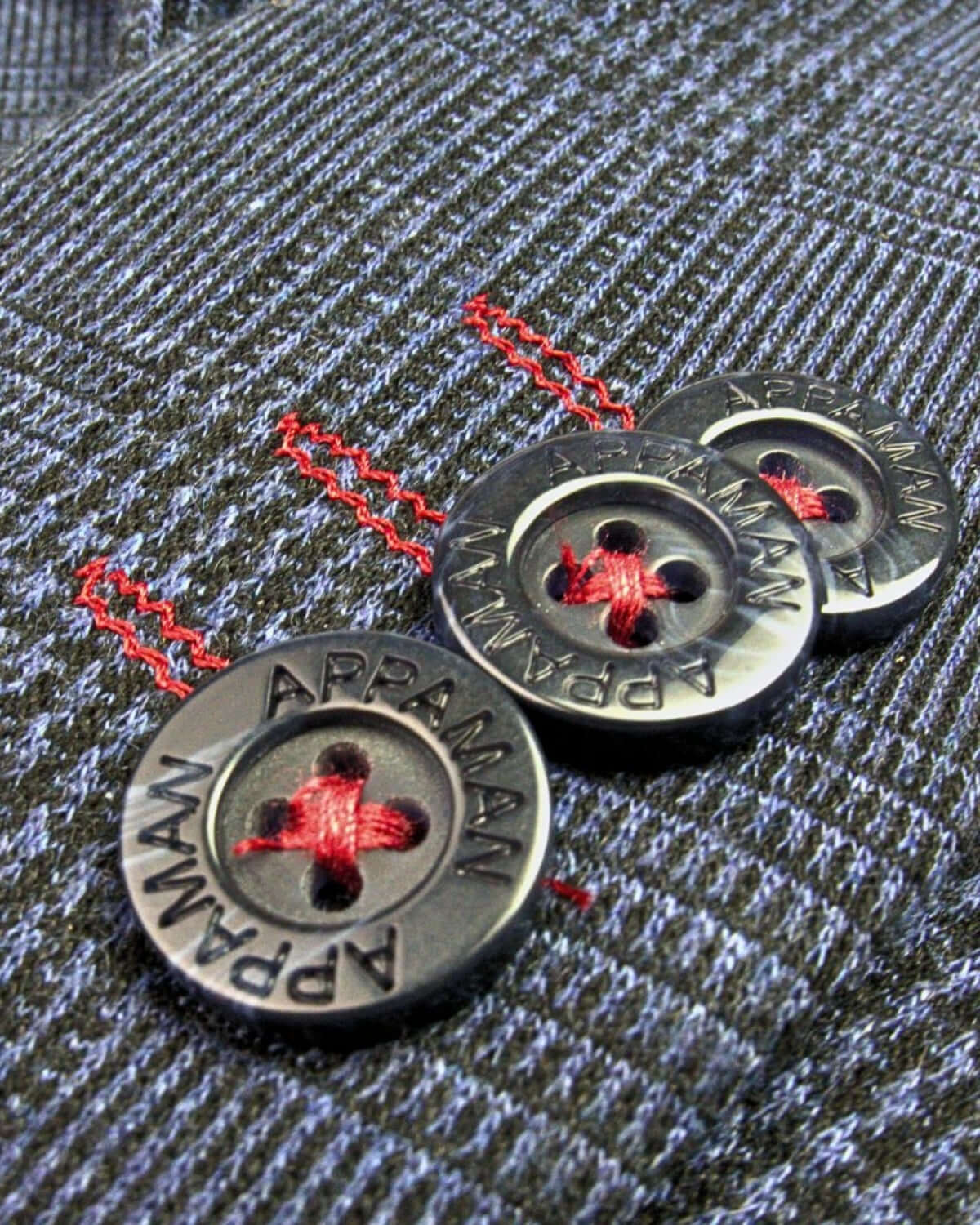 Close-up of Appaman's chic buttons with red stitching on stylish boys and girls mod suit, ready for back to school.