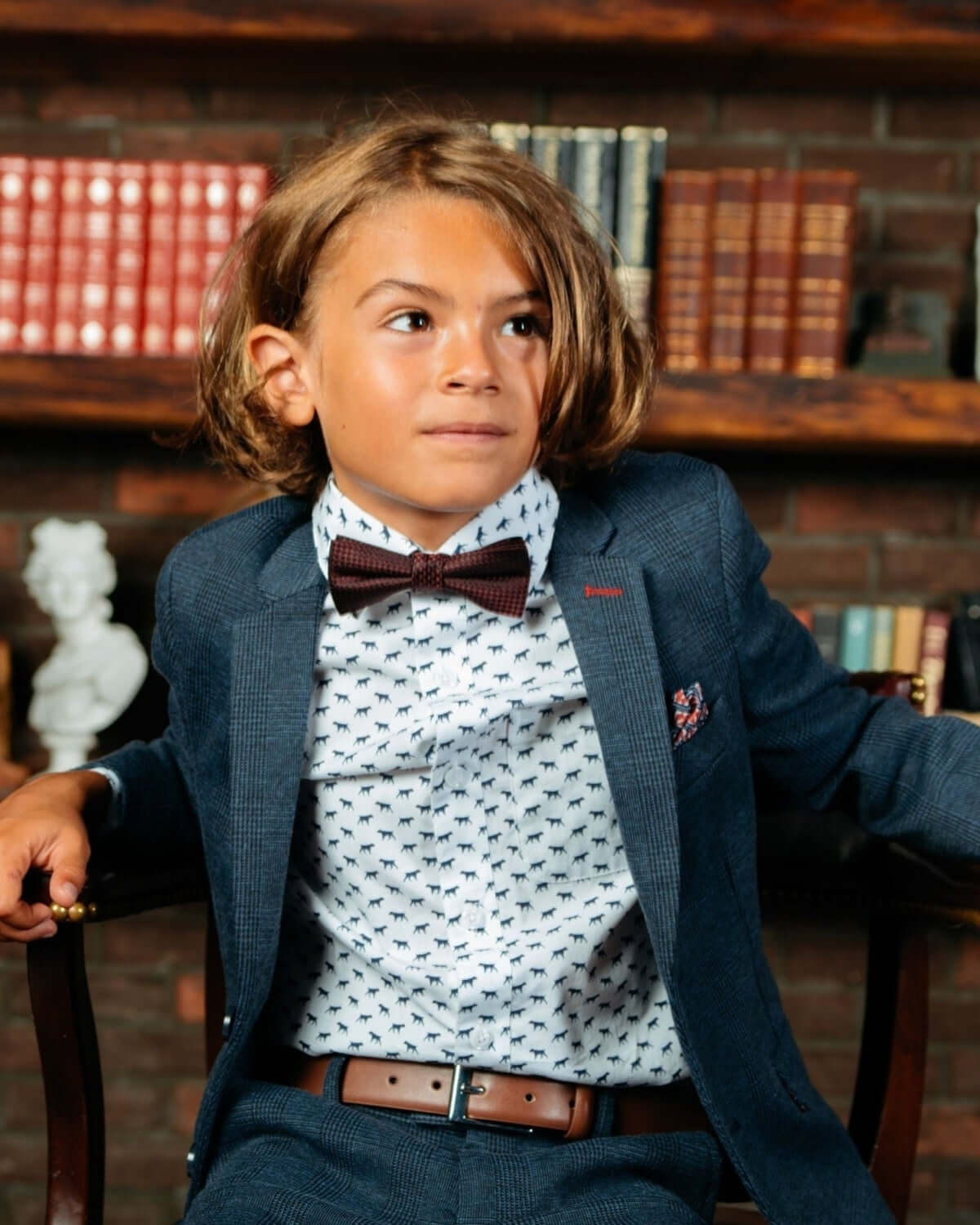 Stylish boy in an Indigo Wales check mod suit, showcasing a playful yet polished look for kids' special occasions.