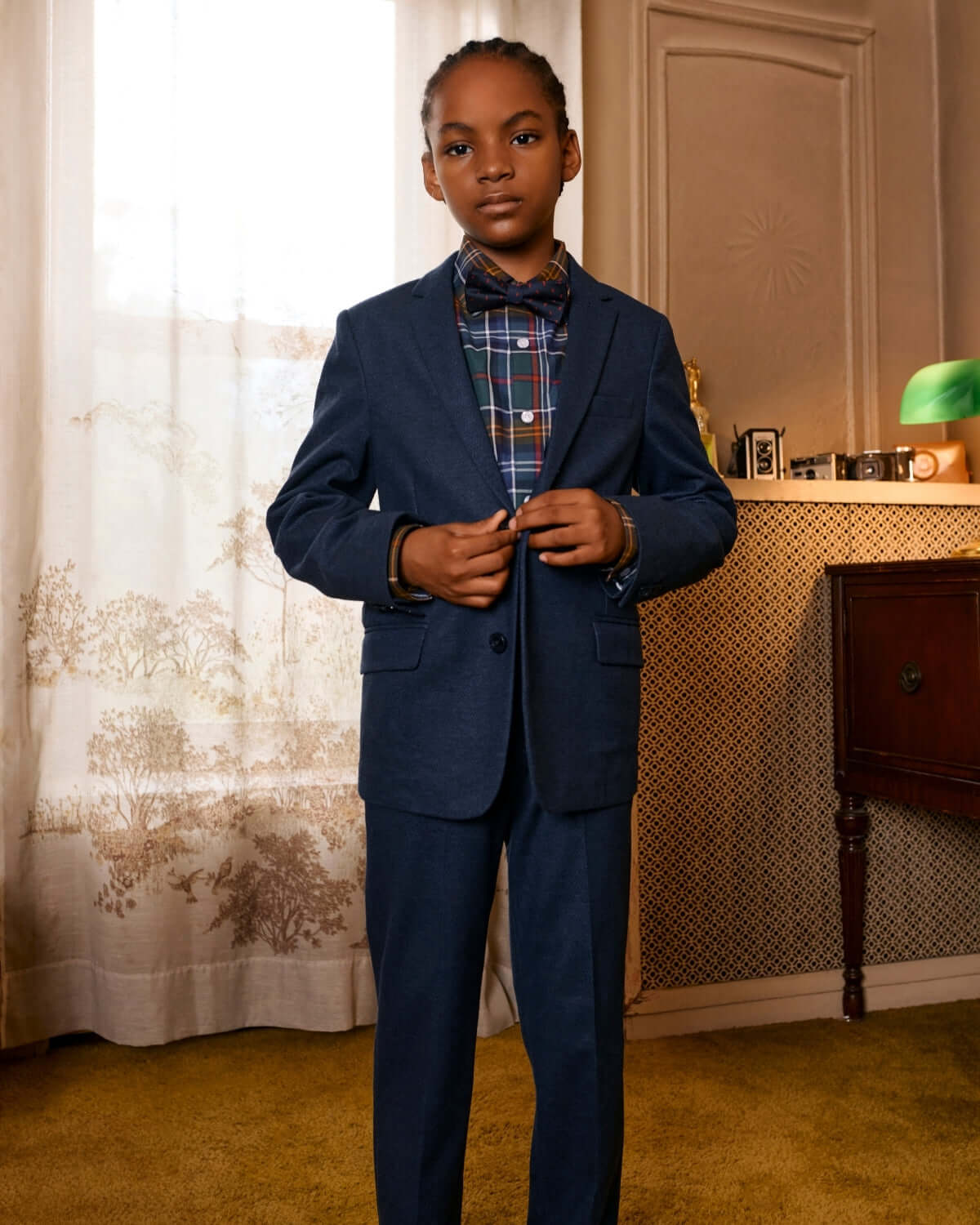 Stylish boy in Navy Diamonds Stretchy Mod Suit, perfect for back to school chic with a playful twist!