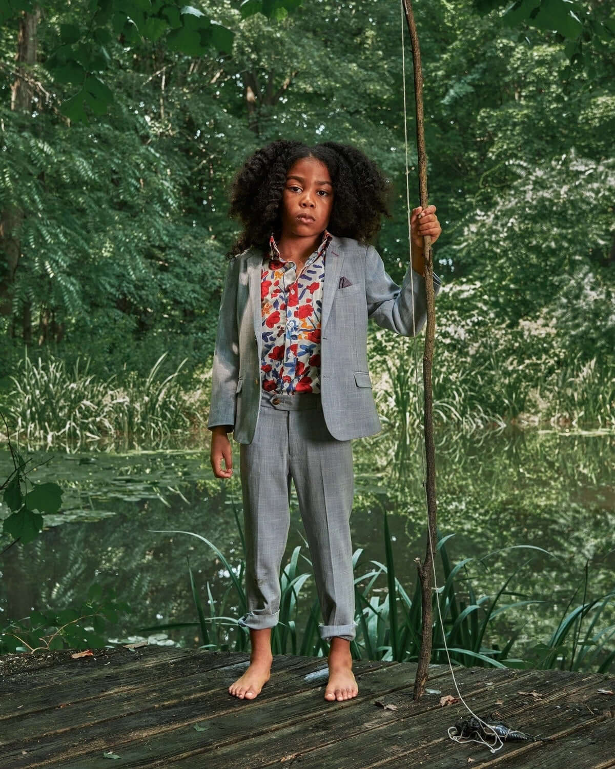 Stylish kid in a Stone Stretchy Mod Suit, exuding confidence while enjoying nature—a modern twist on back-to-school fashion!