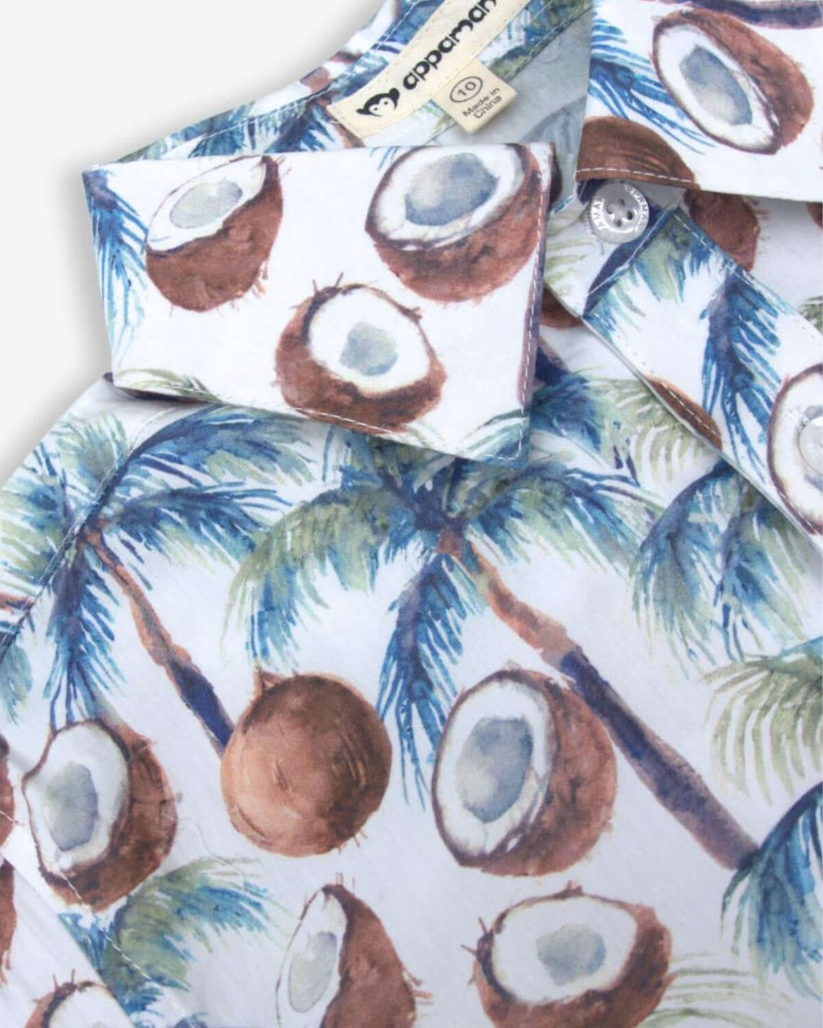Coconut Palms Day Party Shirt for kids, featuring playful coconut print—stylish, breathable, and ready for sunny adventures!