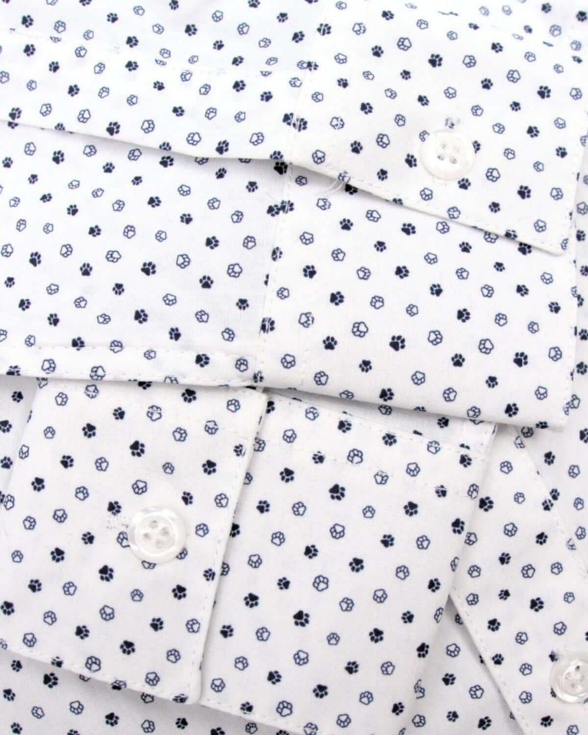 Close-up of playful paw print pattern on the Paw Prints Standard Button Down Shirt—stylish kids clothes for back to school.