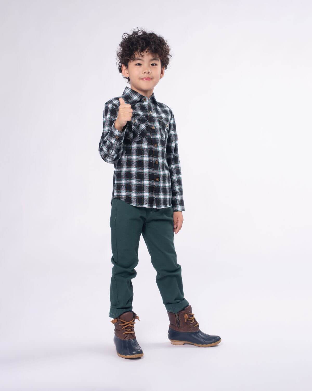 Stylish kid rocking a Black Umber Check Flannel Shirt, perfect for boys and girls—durable kids clothes for back to school!