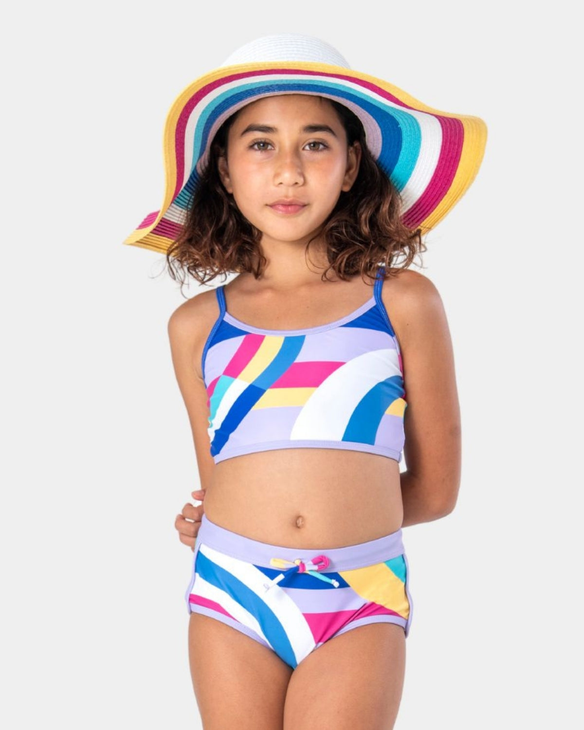 Colorful kids swimsuit and playful wide-brim hat, bringing vibrant summer vibes for stylish beach adventures.