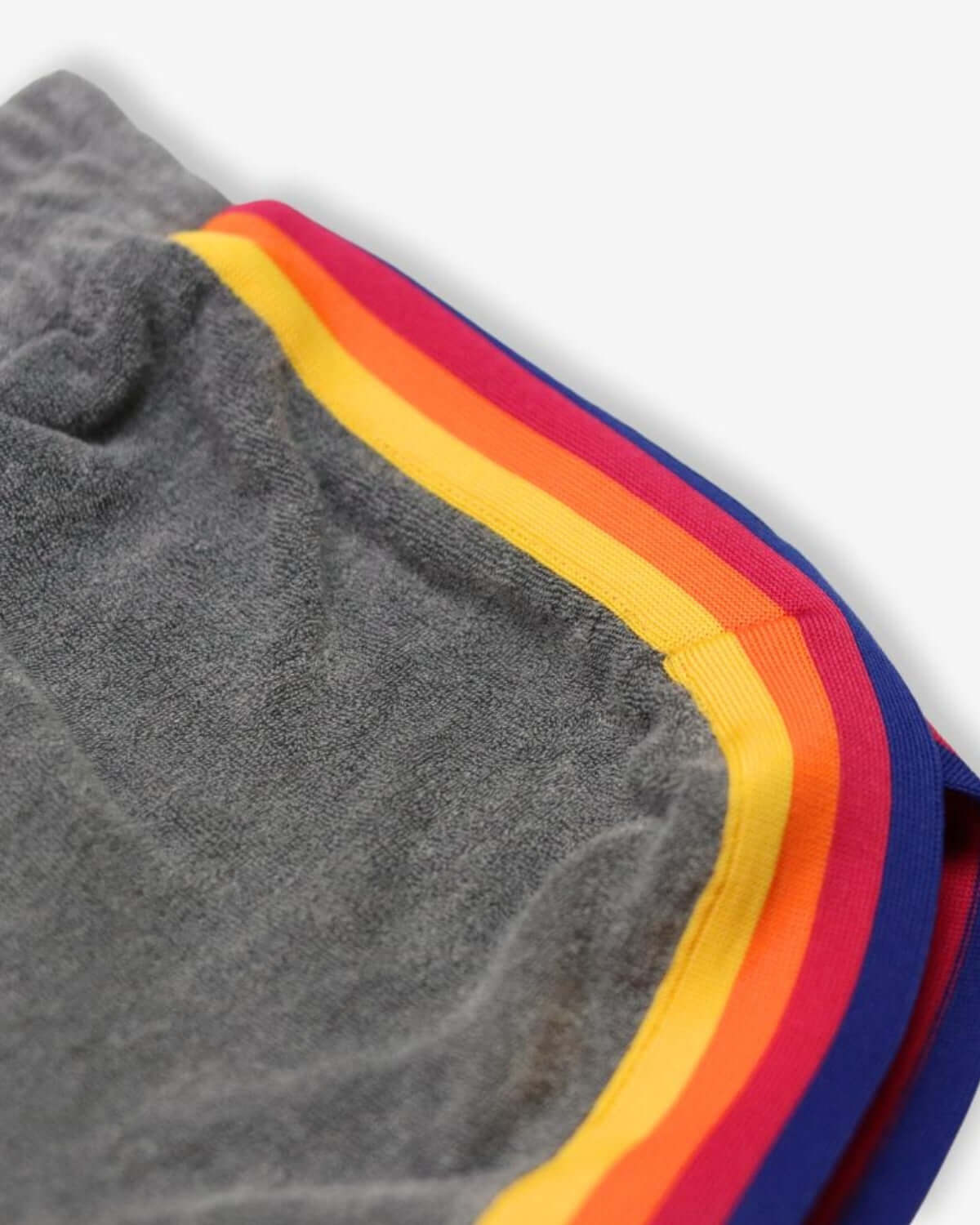 Close-up of the stylish grey Lori shorts with vibrant rainbow stripes—perfect for playful adventures in kids clothes!