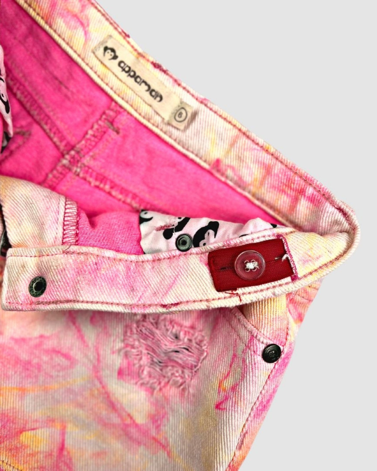 Close-up of Appaman's Neon Lights Rhodes Shorts showcasing vibrant pink denim and playful inner pattern—perfect for stylish kids!