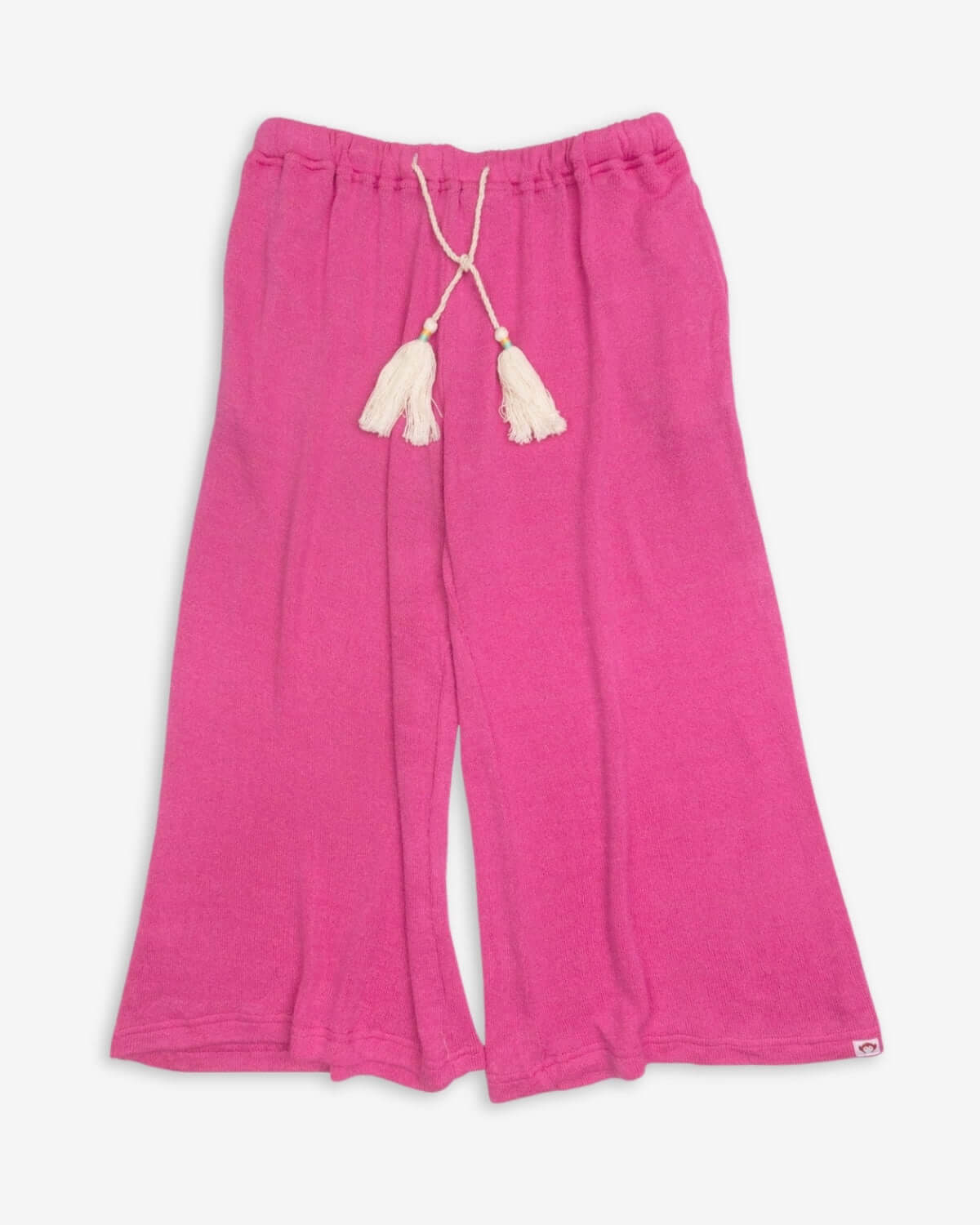 Radiant Pink Beach Pant featuring a lightweight design and tassel details, perfect for beach and town outings.