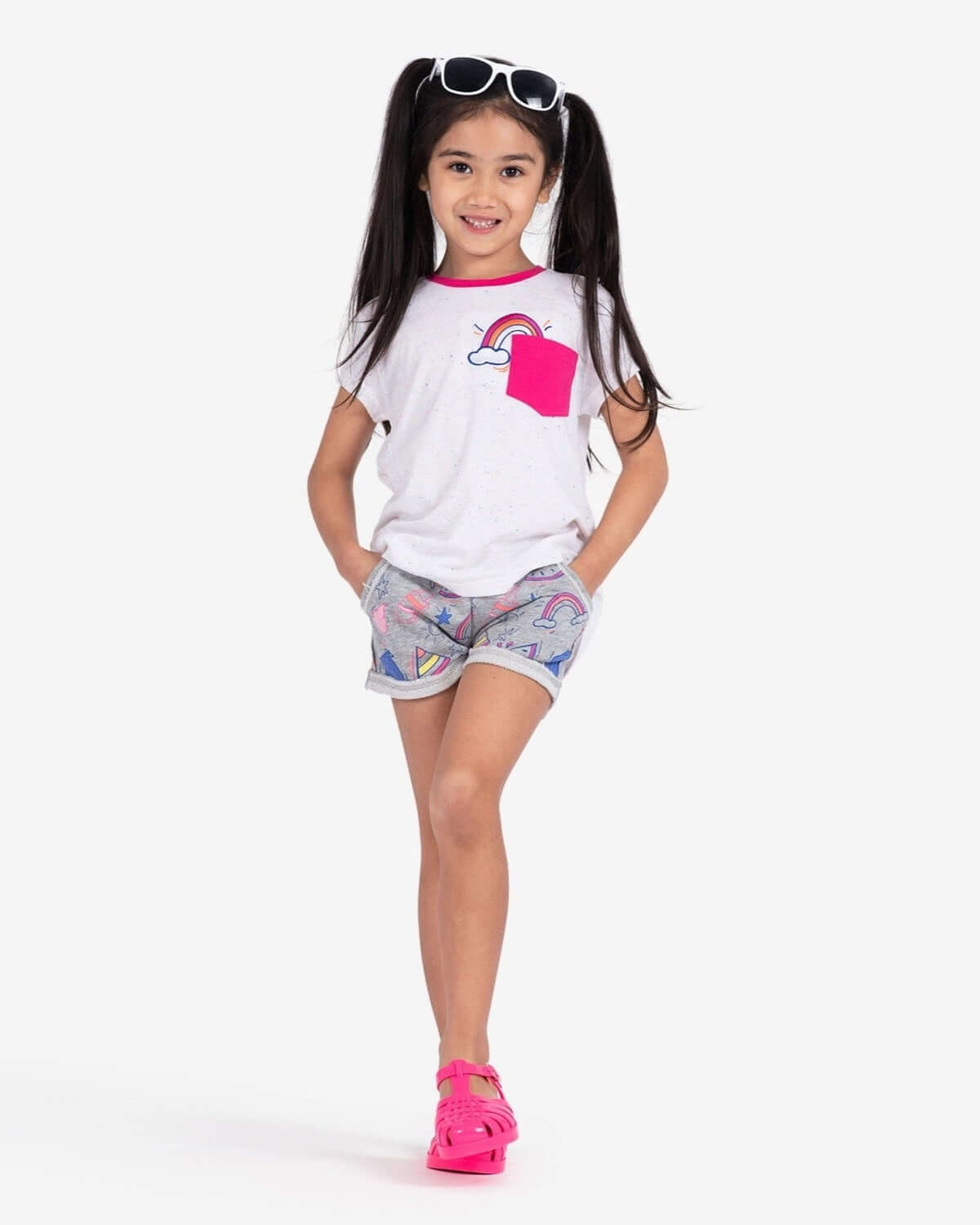 Playful girl in Summer Doodle Majorca Shorts, ready for fun in high-quality kids clothes that shine this back-to-school season!