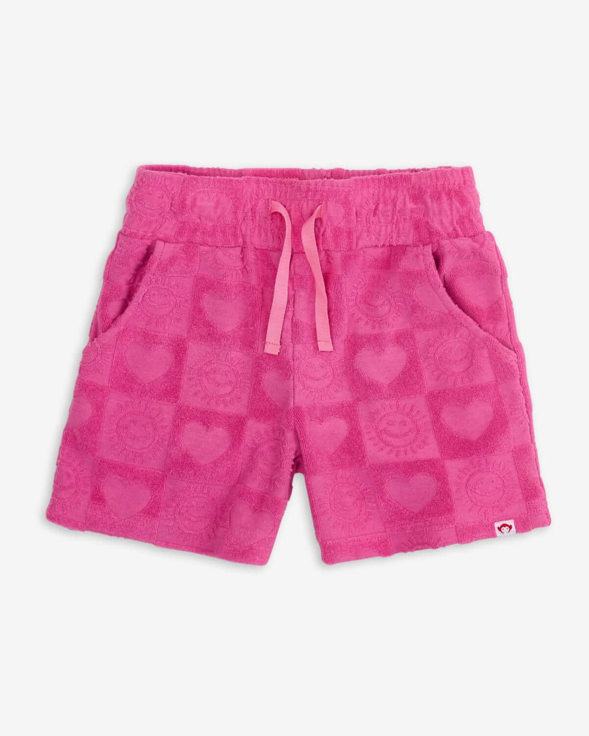 Vibrant pink resort shorts with heart patterns, perfect for stylish kids' summer adventures!