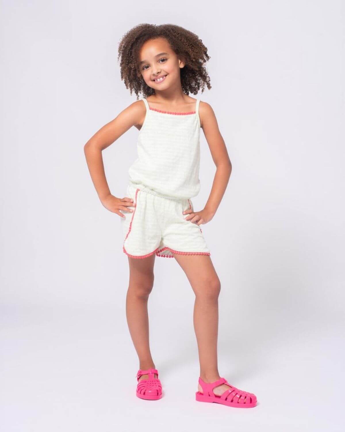 Light Green Stripe Novia Romper on a girl with playful style and comfort, perfect for any adventure.