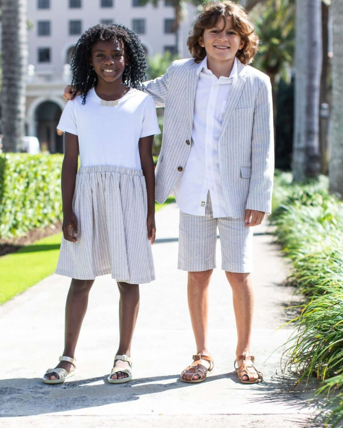 Stylish kids rocking modern sand stripe outfits for back to school fun in high-quality, playful designs.