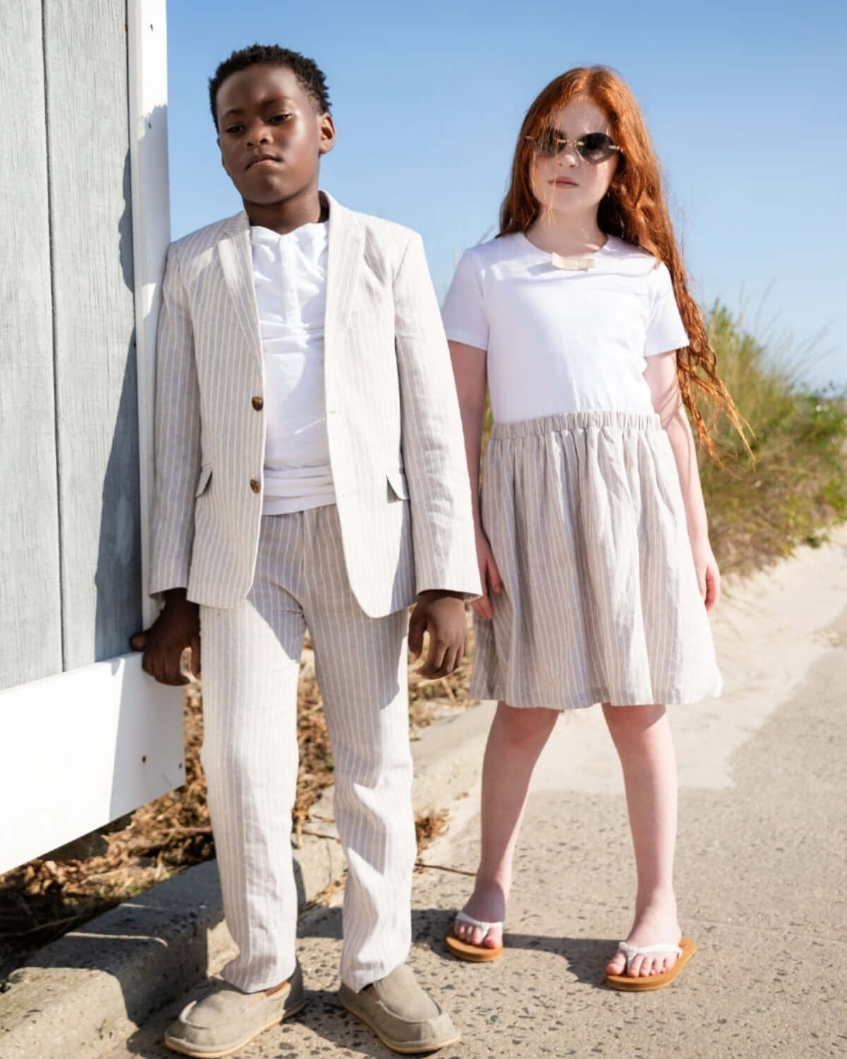 Stylish kids in sand stripe outfits, perfect for back-to-school fun and adventures. High-quality, comfortable kids clothes.