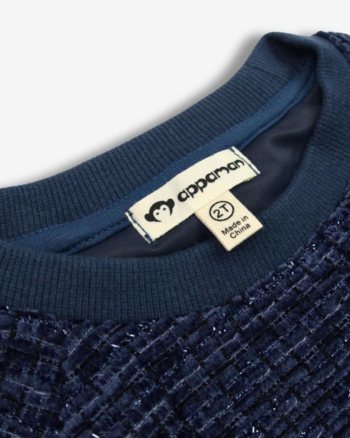 Close-up of Appaman’s Navy Novelty Willow Top, featuring cozy velvet texture—stylish kids clothes for winter celebrations.