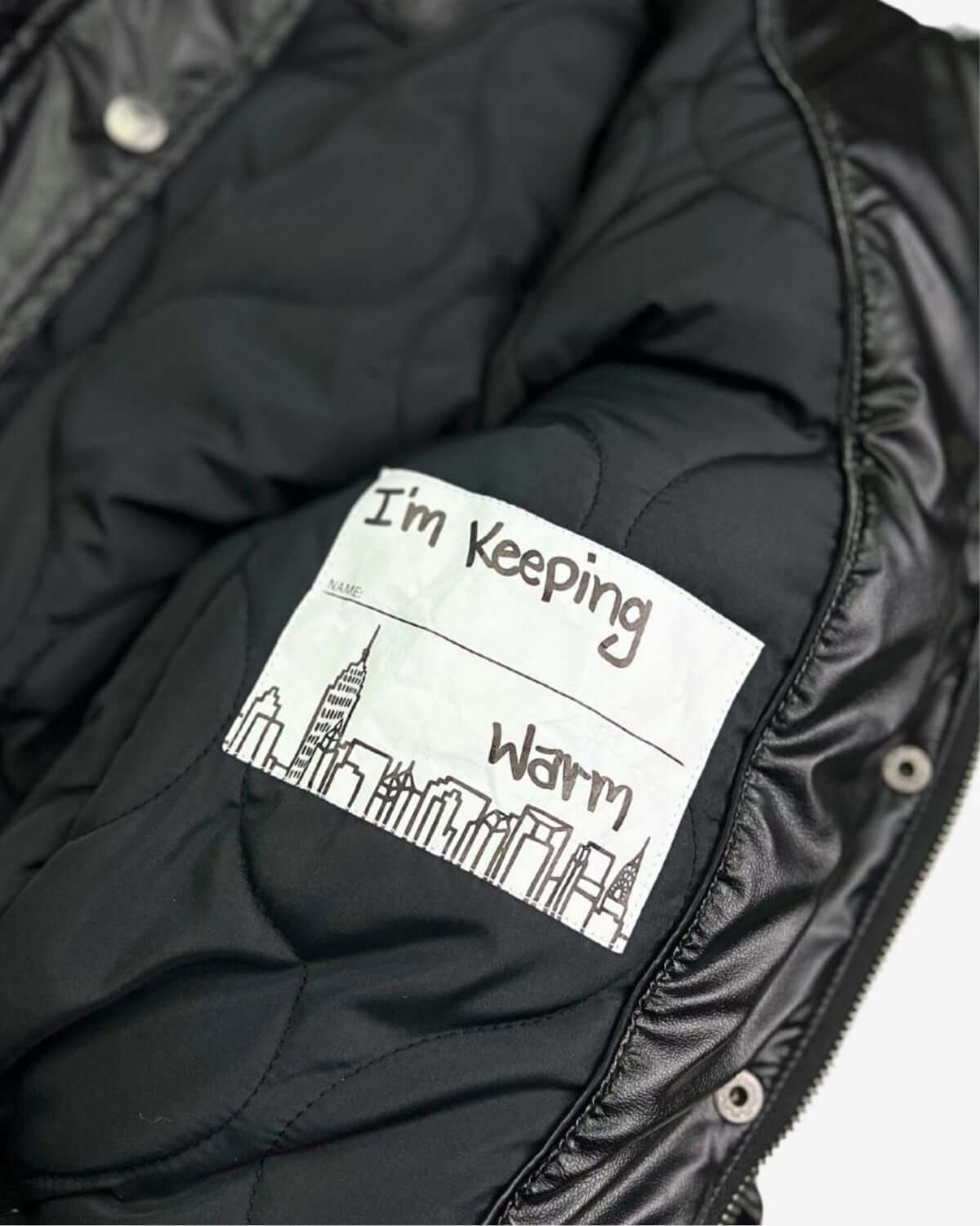 Cozy label in the Kyla Puffer Coat: "I'm Keeping Warm"—stylish warmth for fun winter adventures!