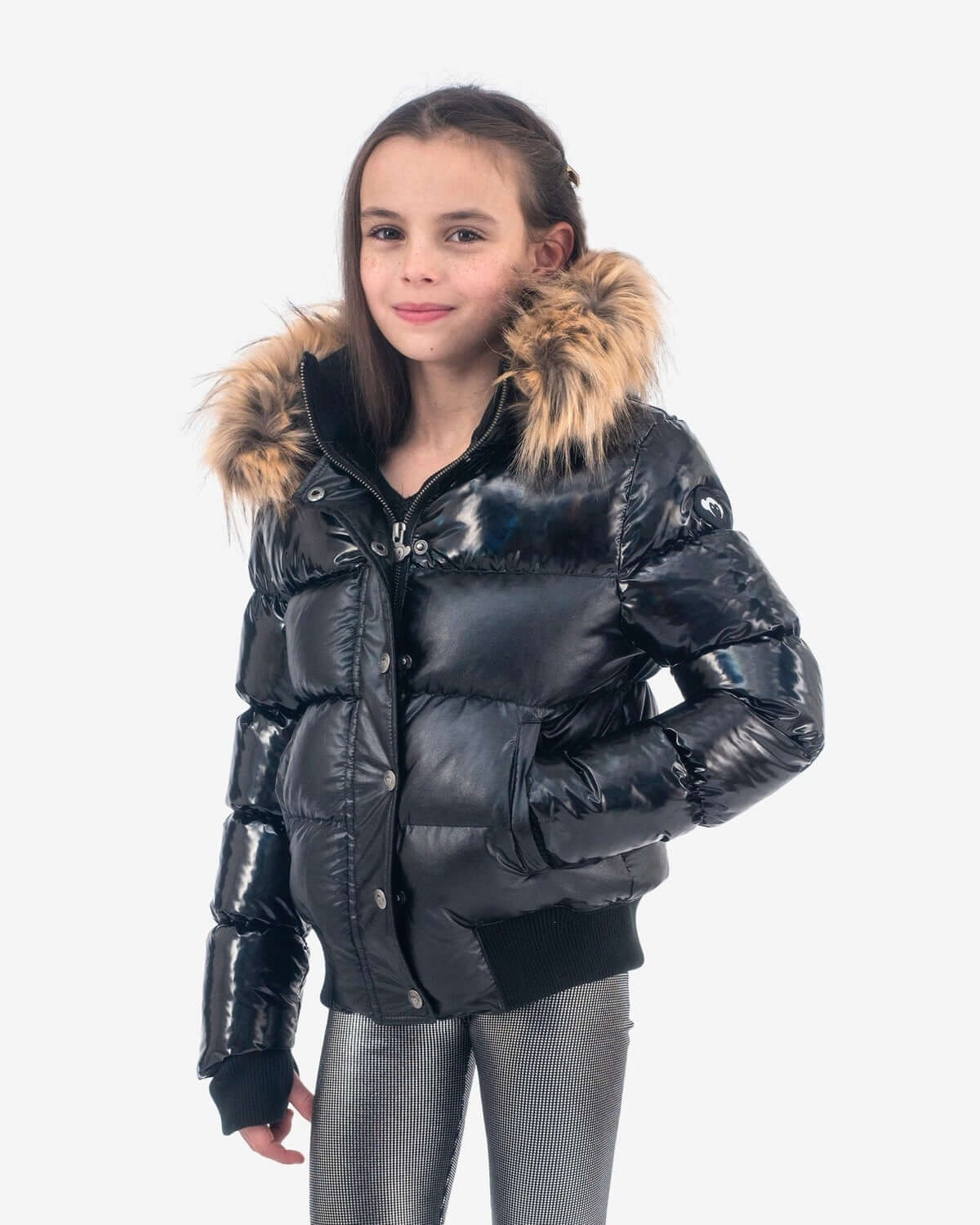 Stylish girl rocking the Black Mix Kyla Puffer Coat, complete with a chic faux fur hood—ideal for warm winter adventures!