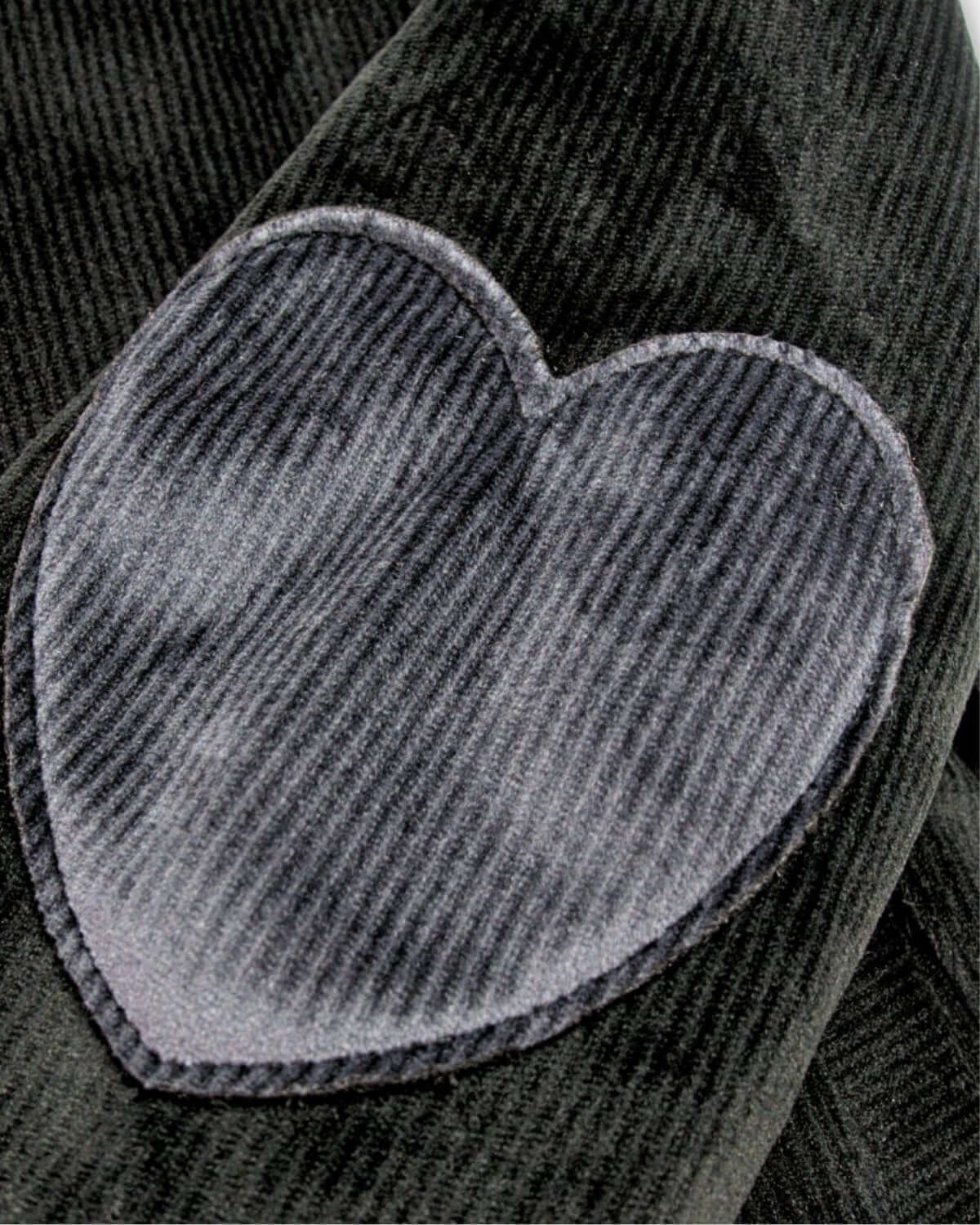 Charming black heart elbow patch on a stylish black Nikki Bomber Jacket for kids, adding flair to their back-to-school wardrobe.