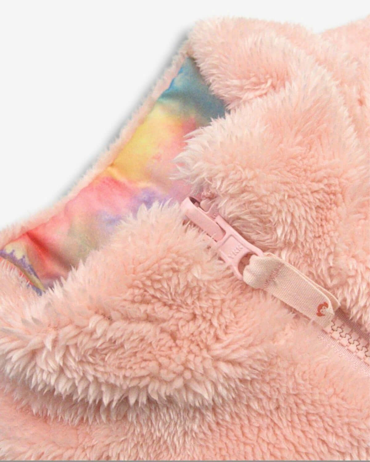 Close-up of cozy salmon pink faux fur lining in Appaman's reversible Candy Cloud vest, perfect for trendy kids clothes.