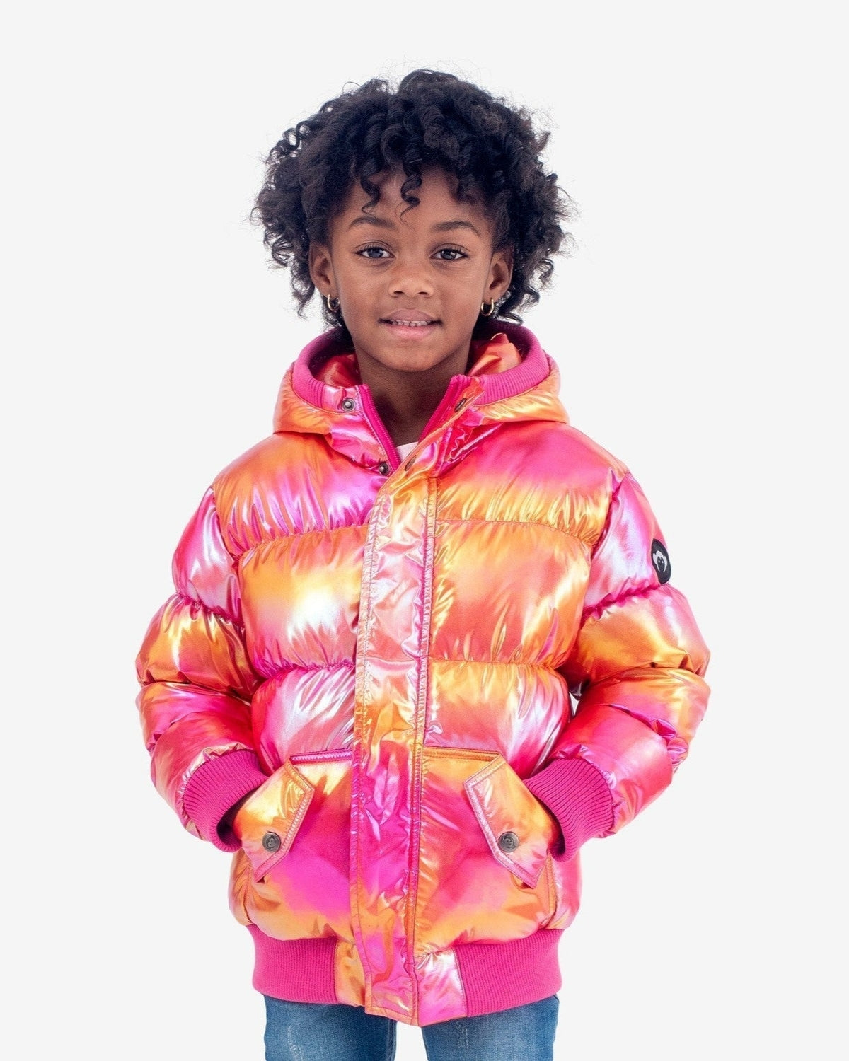 Stylish girl in a vibrant Citrus Sparkle puffy coat, radiating warmth and confidence—ideal kids clothes for winter fun!