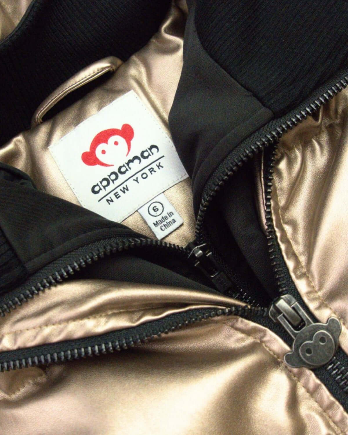 Cozy interior of Appaman's Copper Shine Flurry Coat, ready to keep kids stylishly warm this winter!