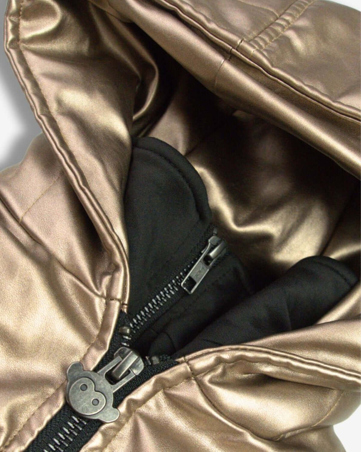 Close-up of the Copper Shine Flurry Coat's stylish hood and cozy lining, perfect for kids braving the cold with flair!